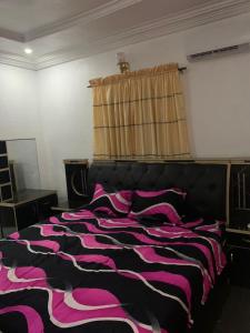 Postel nebo postele na pokoji v ubytování Blossom Apartment