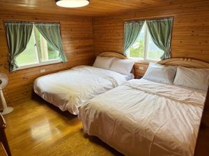 Postel nebo postele na pokoji v ubytování Lala Mountain San hao Manor