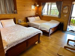 Postel nebo postele na pokoji v ubytování Lala Mountain San hao Manor