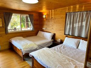Postel nebo postele na pokoji v ubytování Lala Mountain San hao Manor