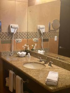 a bathroom counter with a sink and a mirror at Hotel Boutique Casona del Cafetal and Lakeside Restaurant in Cachí +37 photos