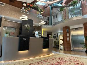 a store lobby with a staircase and a rug at Cascina Scova Resort in Pavia