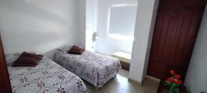 Кровать или кровати в номере Apartamento Vacacional centro San Gil