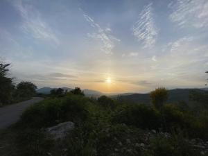 a view of the sunset from a mountain road at La Primula del Cervati - CASA VACANZE in Piaggine