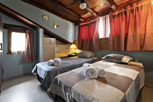 Cama o camas de una habitación en Casa Rural Gite El Tossal