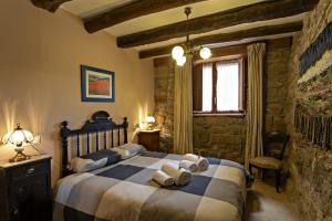Cama o camas de una habitación en Casa Rural Gite El Tossal