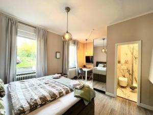 Postel nebo postele na pokoji v ubytování Villa Rosa Bad Camberg
