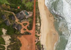 an overhead view of a beach and the ocean at Filha Da Lua Ecolodge in Pipa
