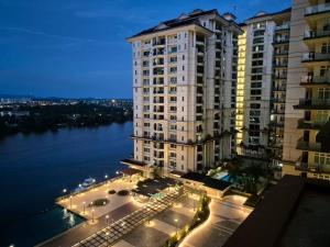 a large apartment building with a view of the water at Good view stay in Kuching