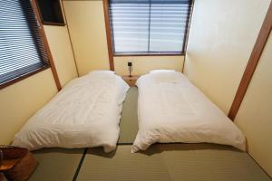Letto o letti in una camera di 宿屋GONDO aioi
