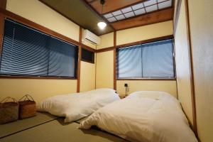 Letto o letti in una camera di 宿屋GONDO aioi