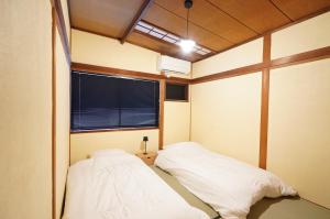 Letto o letti in una camera di 宿屋GONDO aioi