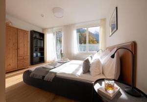 En eller flere senger på et rom på Apartment Jungfrauview