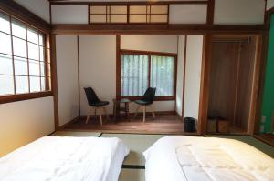 Letto o letti in una camera di 宿屋GONDO aioi