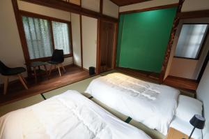 Letto o letti in una camera di 宿屋GONDO aioi