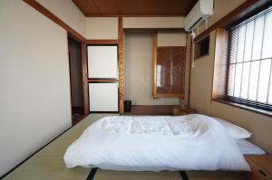 Letto o letti in una camera di 宿屋GONDO aioi