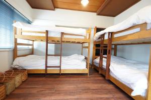 Letto o letti in una camera di 宿屋GONDO aioi