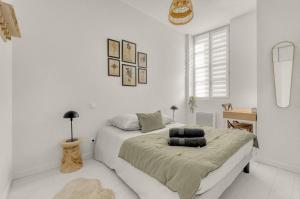 Una cama o camas en una habitación de ღ La Colonne - Métro et Gare Matabiau SNCF à 400m