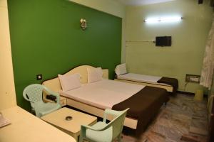 Postel nebo postele na pokoji v ubytování Hotel chela