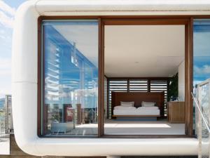 Rúm í herbergi á Hotel Daniel Graz - Smart Lifestyle Near City Centre