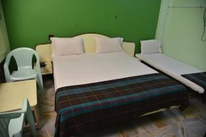 Postel nebo postele na pokoji v ubytování Hotel chela