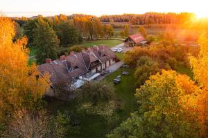 an aerial view of a house in the forest at Karlamuiza Country Hotel in Kārļi