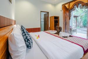 Postel nebo postele na pokoji v ubytování Sebujan Grand Aurora