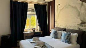 Postel nebo postele na pokoji v ubytování hotel whiteswan