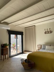 A bed or beds in a room at Casa de camp Les Tretes