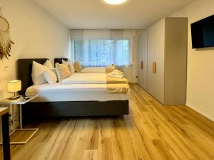 Ένα ή περισσότερα κρεβάτια σε δωμάτιο στο 3 Zimmer Apartment, 82 qm, max 5 Pers, Balkon, Garage, Internet 300 mBit