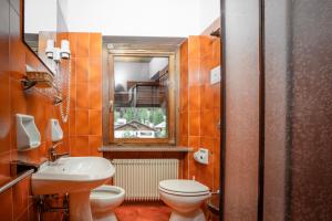 Koupelna v ubytování Hotel Sporting