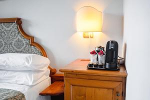 Postel nebo postele na pokoji v ubytování Hotel Sporting