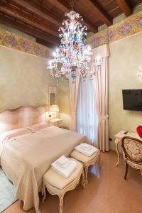 Postel nebo postele na pokoji v ubytování Corte Farina Suites