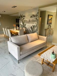 a living room with a couch and a table at The Point in Yerba Buena