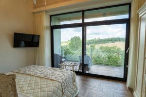 TV a/nebo společenská místnost v ubytování Relais Sassa al Sole