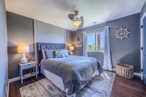 a bedroom with a bed and a window at Amazing Views, 3 Patios, Game Room, Modern Update in Kaiser