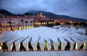 a large amphitheater with a city in the background at Menton: superbe appartement in Menton +4 photos