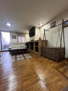 a large living room with a large screen in it at ESTUDIO LAS PALMILLAS in Puebla del Río