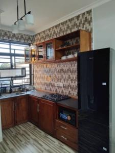 Kuchyň nebo kuchyňský kout v ubytování JnC Homes