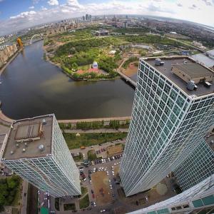 an aerial view of a large building with a river at Апартаменты на набережной с панорамным видом на 39 этаже in Astana