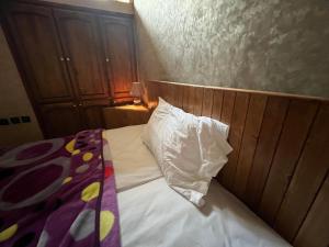 Postel nebo postele na pokoji v ubytování Dar Calme Chez El Bouhali
