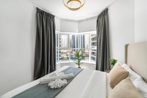 Кровать или кровати в номере Modern Studio Apartment in JLT