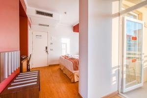 Postel nebo postele na pokoji v ubytování Muthu Raga Madeira Hotel