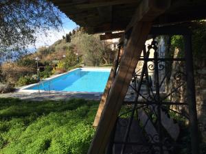 a view from a balcony of a swimming pool at Agriturismo S.Ilario in Genoa +29 photos