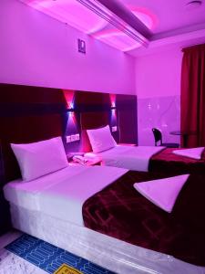 Postel nebo postele na pokoji v ubytování Saeed Hotel