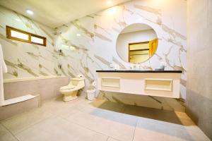 a bathroom with a sink and a mirror at El Rodeo Estancia Boutique Hotel & Steakhouse in San José +47 photos