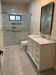 a bathroom with a shower and a sink and a toilet at New Constructed Home in Poway in Poway +50 photos