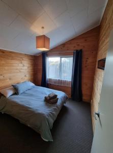 Postel nebo postele na pokoji v ubytování Manapouri Beech Haven