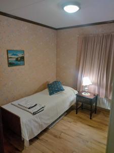 Ένα ή περισσότερα κρεβάτια σε δωμάτιο στο Villa Lovisa
