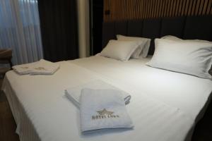 Postel nebo postele na pokoji v ubytování Hotel Luna